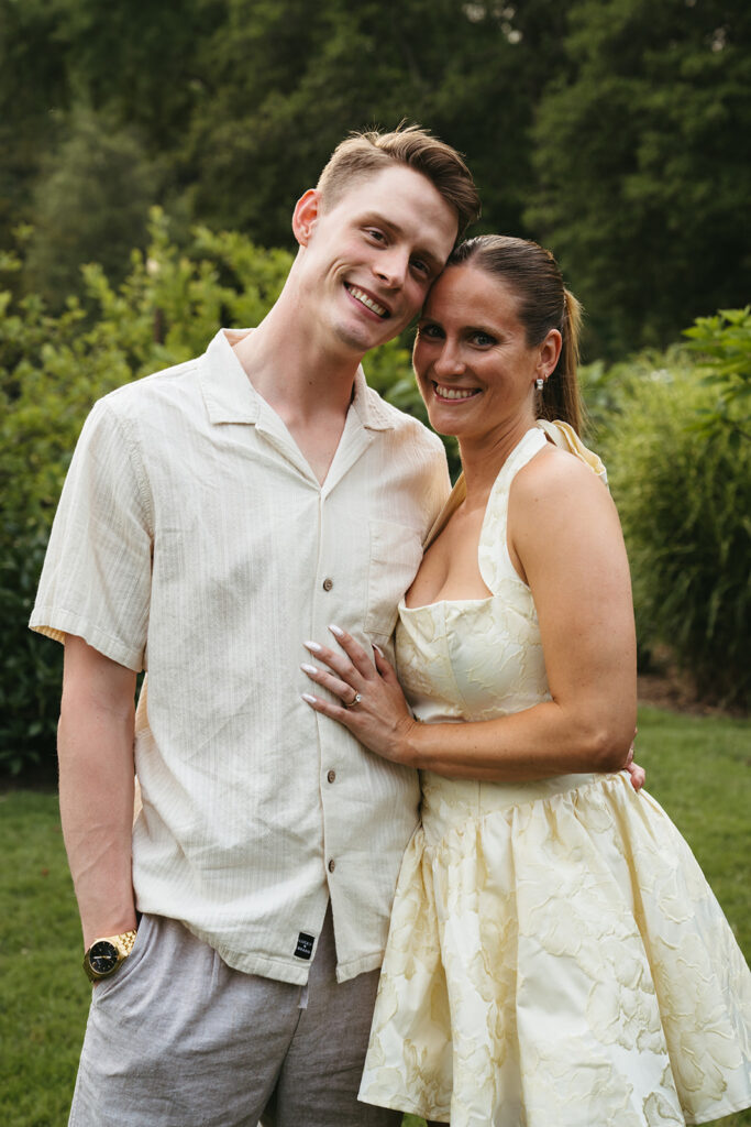 couple smiling at the camera during their photoshoot
