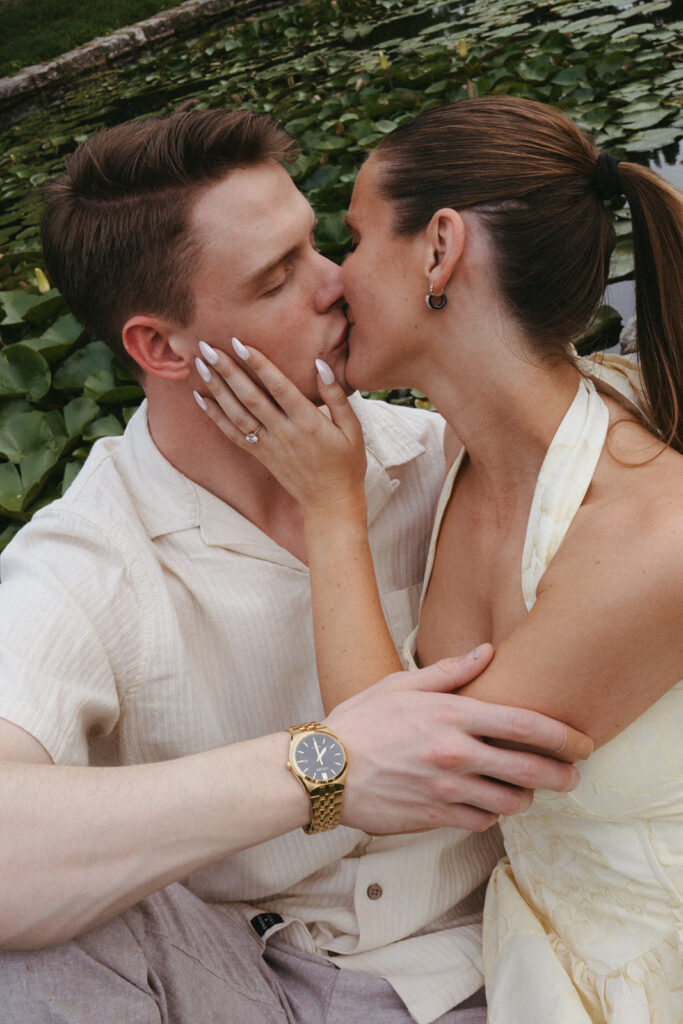 portrait of the newly engaged couple kissing