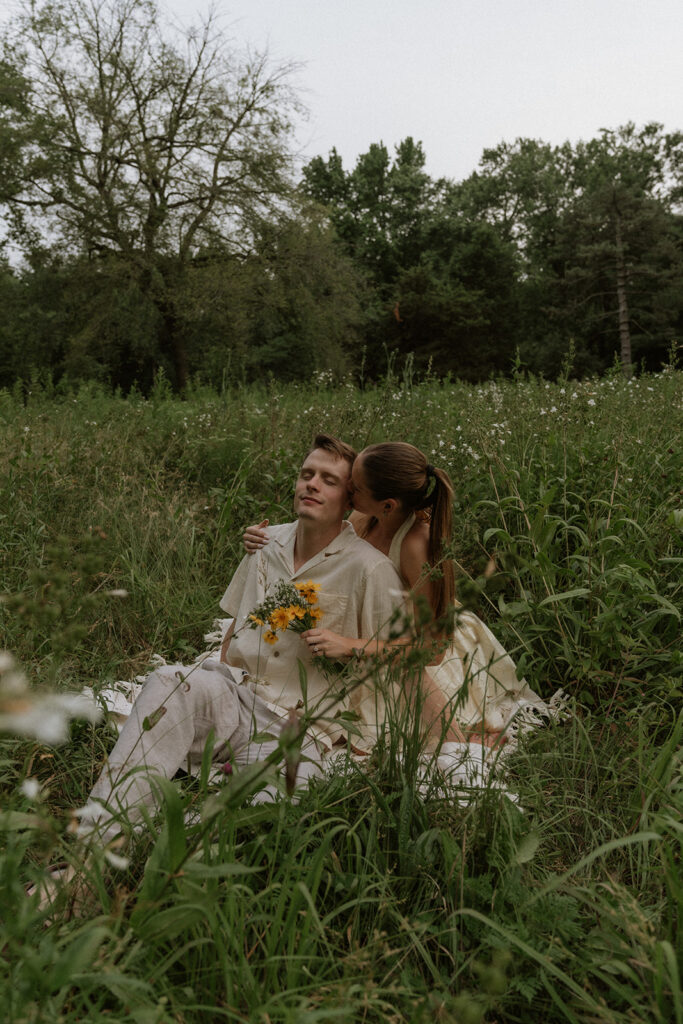 fiance kissing her fiance on the cheek