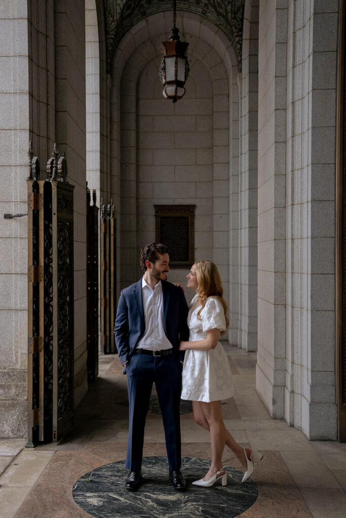 Couple smiling at each other during their photoshoot