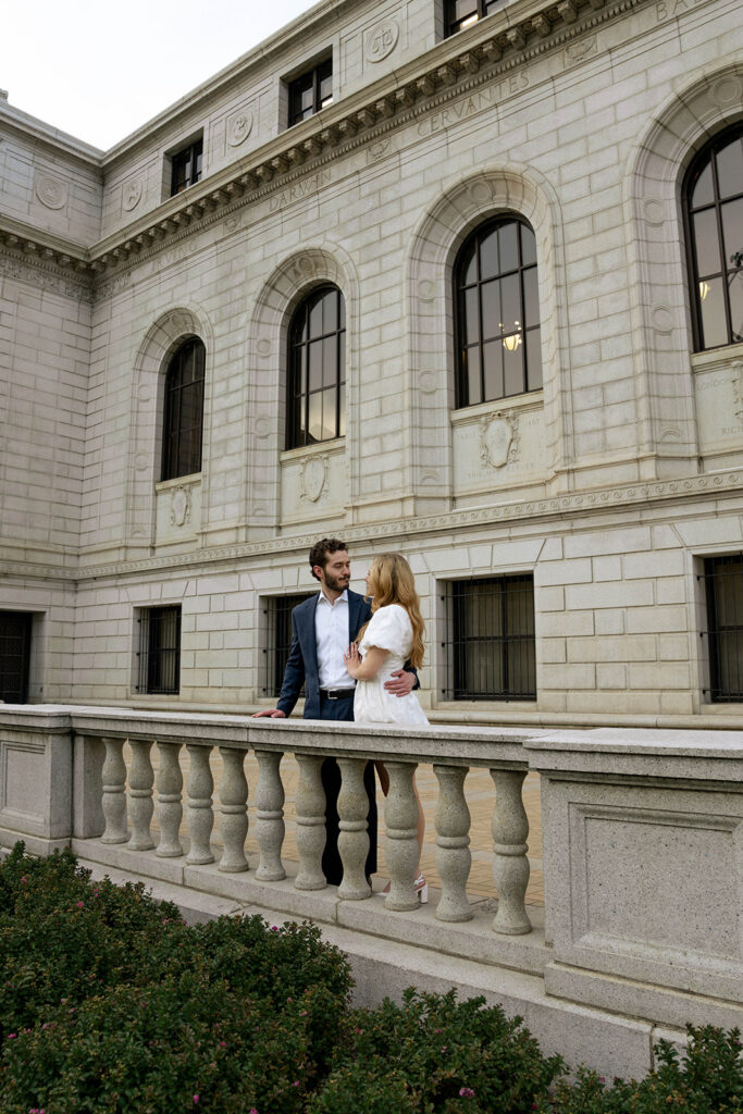 couple smiling at each other during their photoshoot