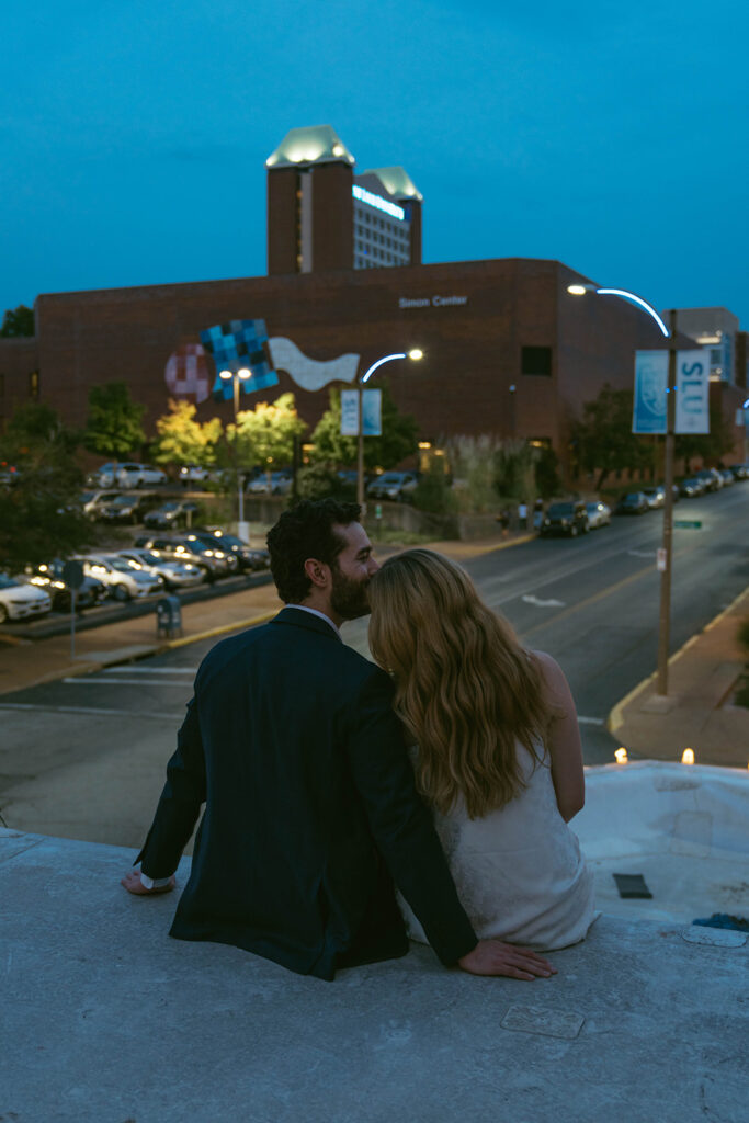 fiance kissing his fiance on the cheek
