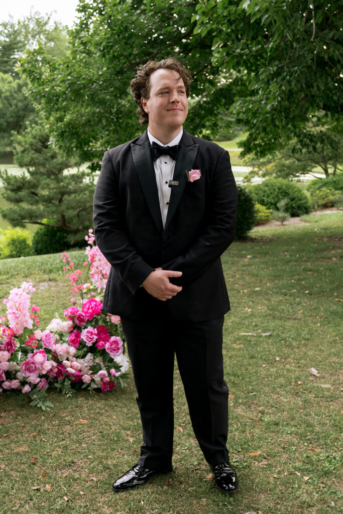 Groom, watching the bride walk down the aisle