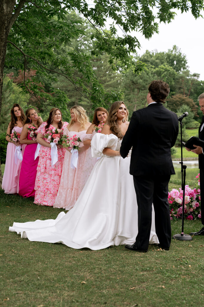 Cute portraits of the bride and groom, smiling at each other during their ceremony