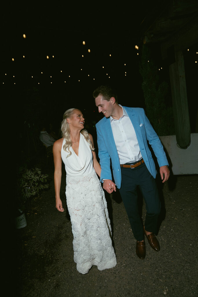 cute portrait of the bride and groom holding hands
