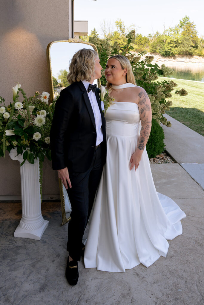 cute picture of the couple smiling at each other during their photoshoot 