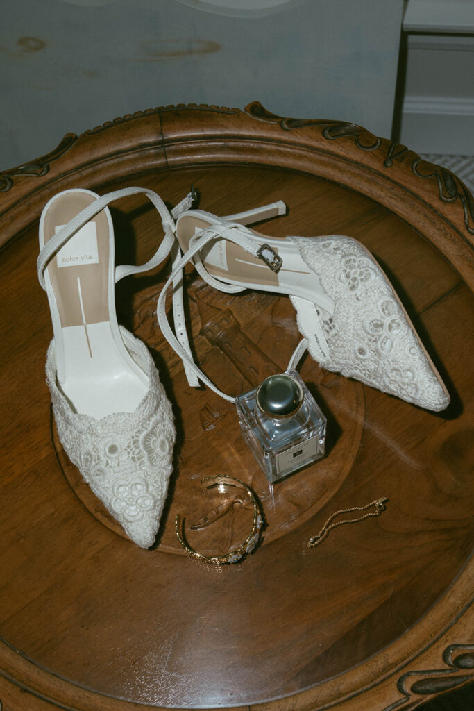 beautiful picture of the wedding shoes and the perfume the bride wore for her st. louis wedding