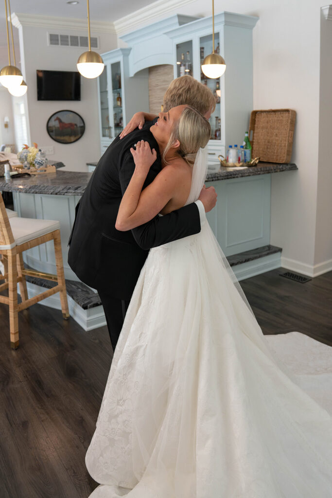 cute picture of the bride and her brother hugging