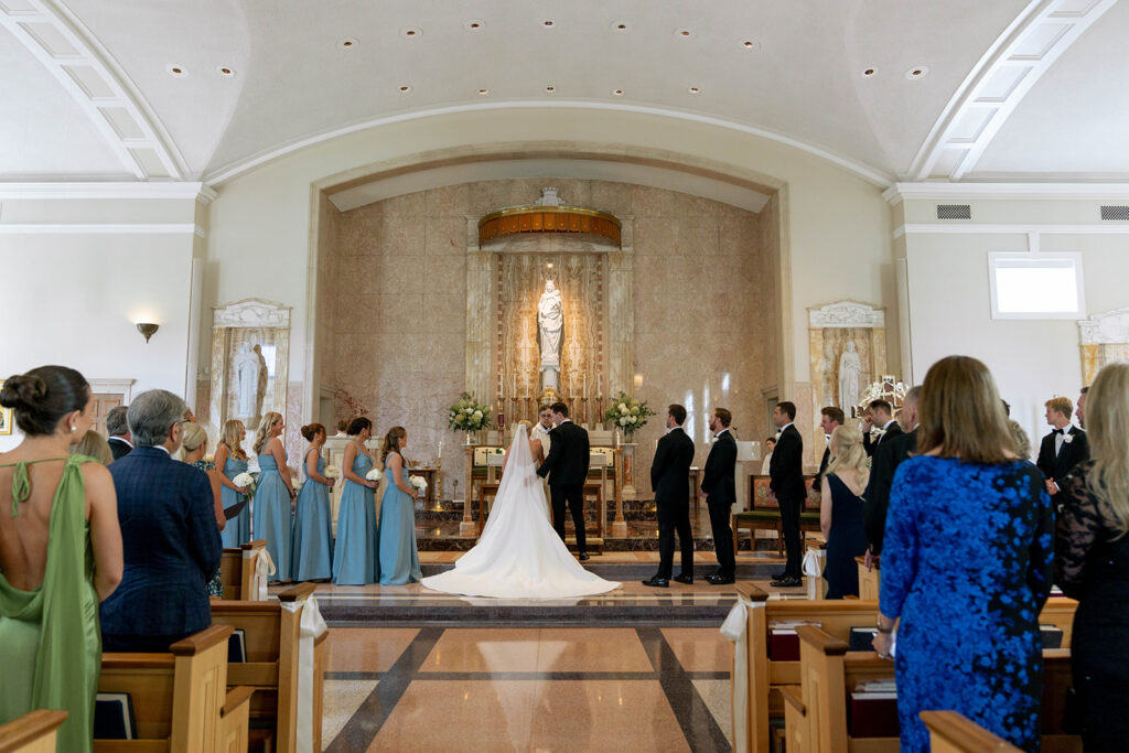 bride and groom holding hands during their ceremony