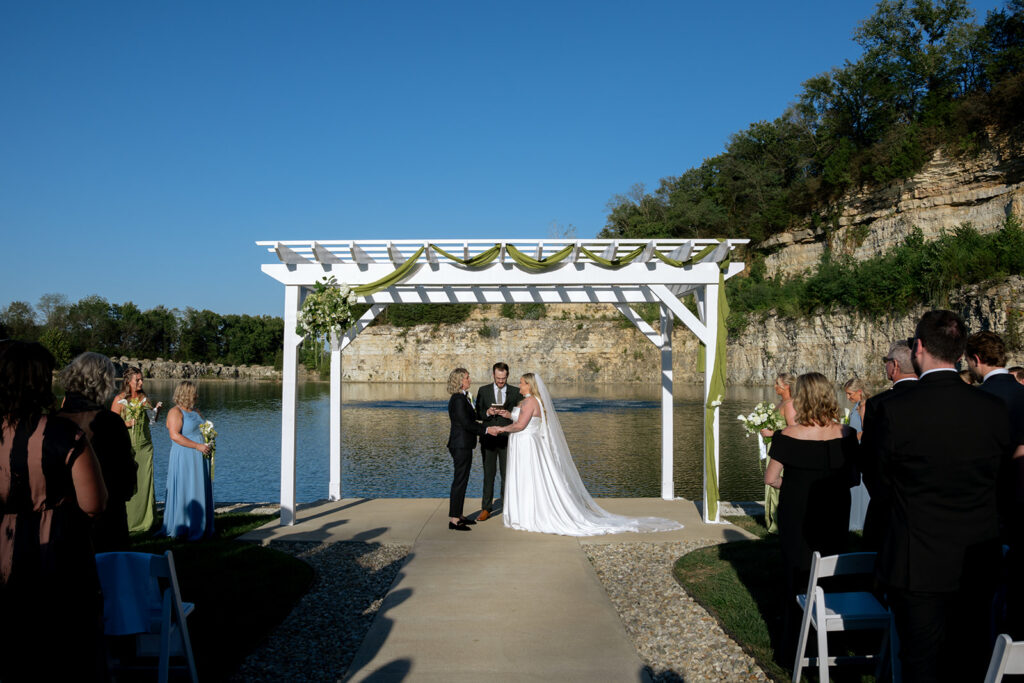 couple holding hands during their cermeony