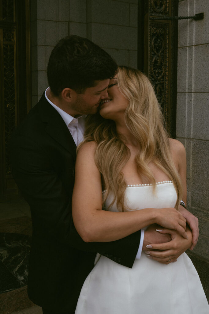 Cute picture of the newly engaged, couple kissing