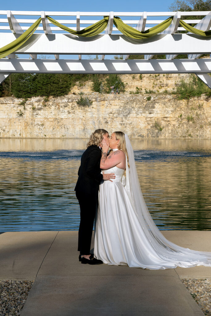 brides kissing after their ceremony