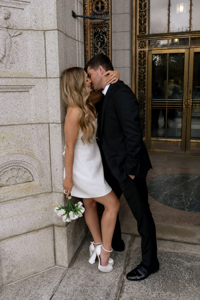 picture of the newly engaged couple kissing during their photoshoot