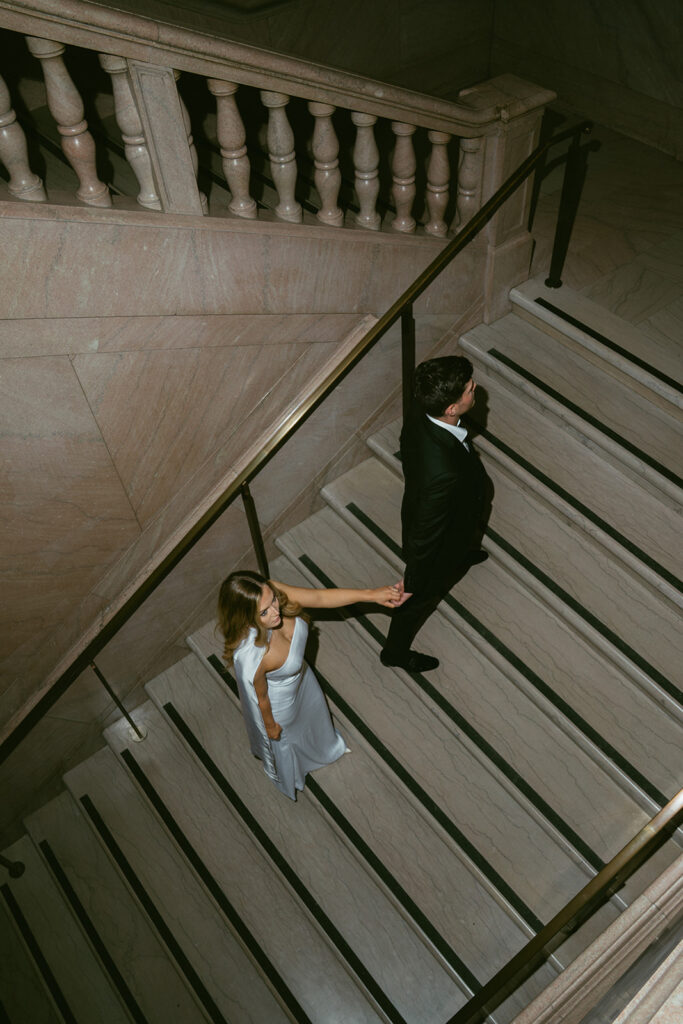 cute picture of the newly engaged couple holding hands