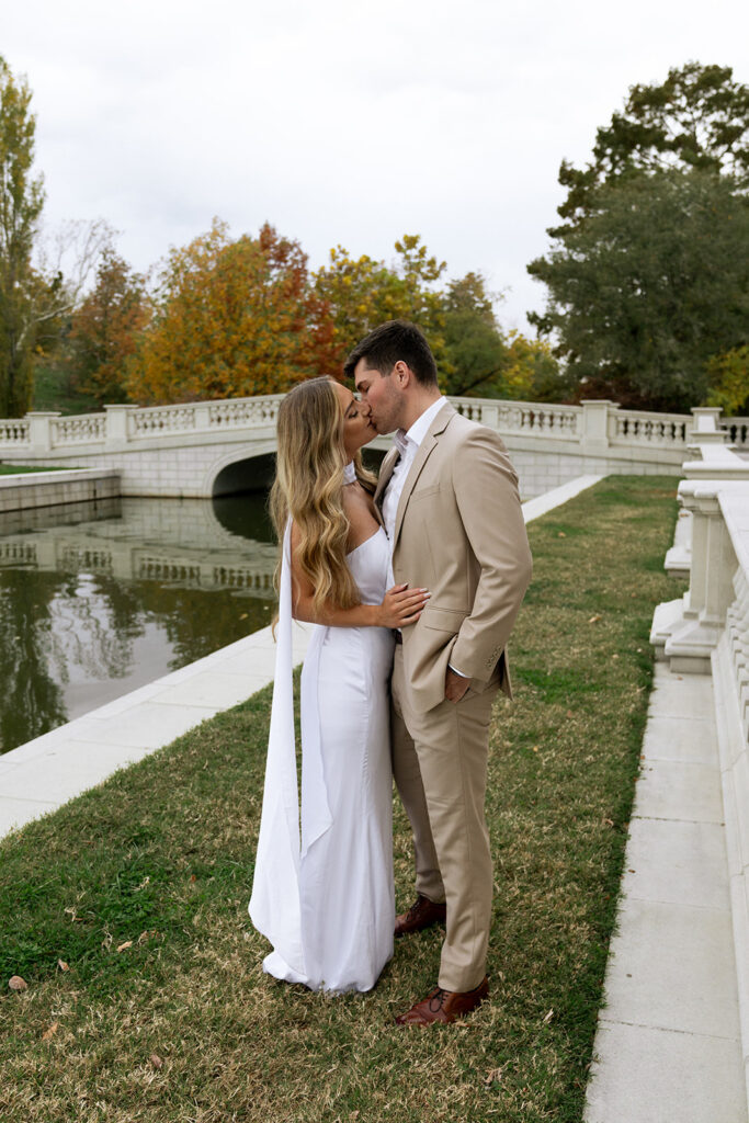 cute picture of the newly engaged couple kissing  during their editorial session in st. louis