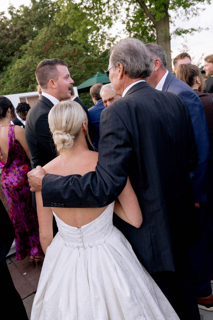 bride and groom at their fun cocktail hour reception
