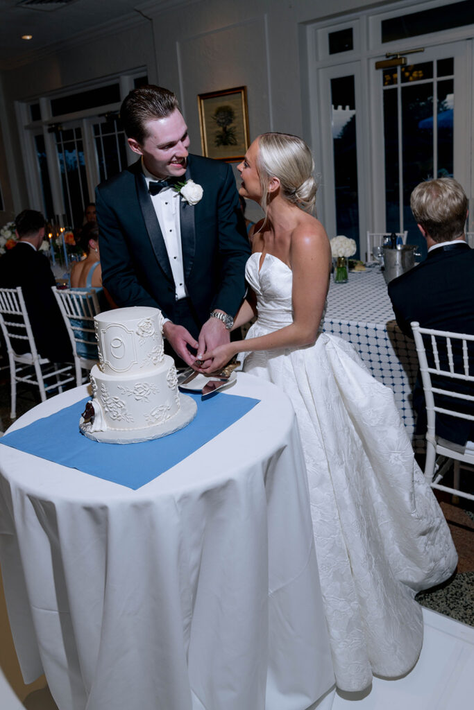 newlyweds cutting their wedding cake