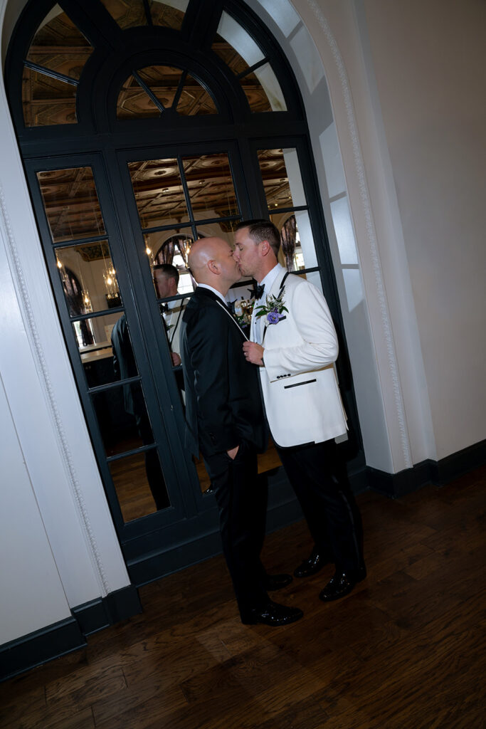 cute picture of the couple kissing during their bridal portraits