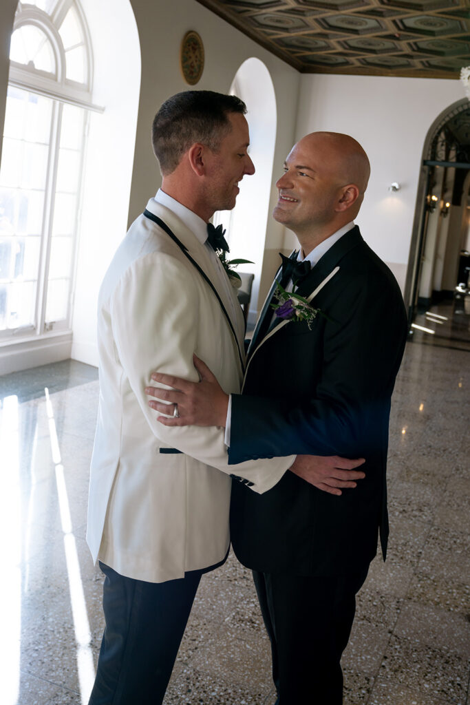 couple smiling at each other during their bridal session