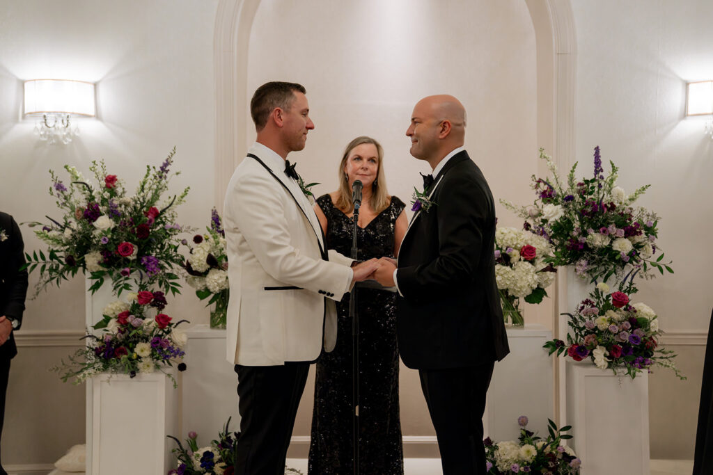 cute picture of the couple holding hands during their ceremony