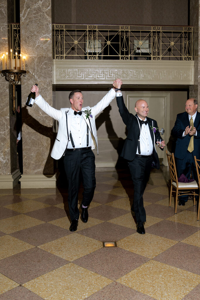 newly married couple arriving at their reception
