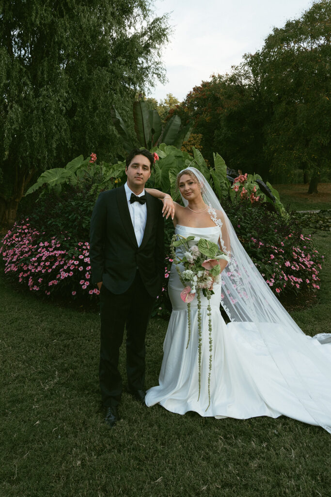portrait of the newlyweds smiling at the camera during their bridal portraits