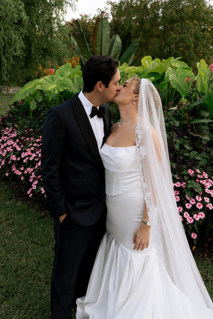 portrait of the newlyweds kissing
