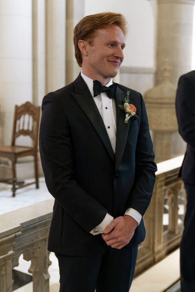 picture of the groom watching the bride walk down the aisle