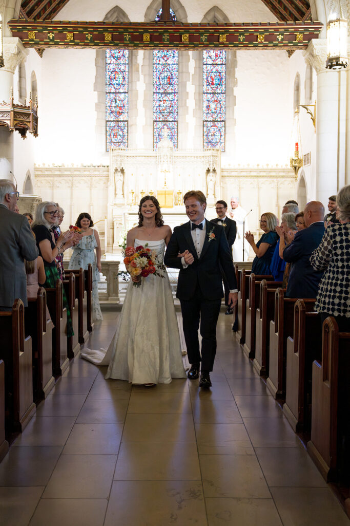 cute picture of the newlyweds heading to their wedding reception