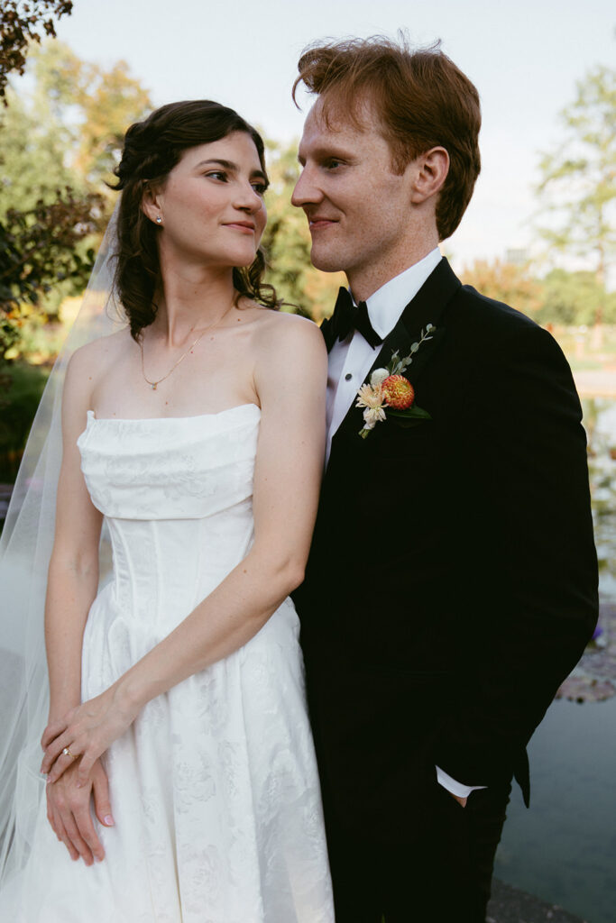 cute picture of the newlyweds smiling at each other