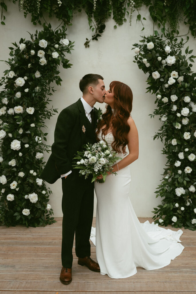 cute picture of the bride and groom kissing