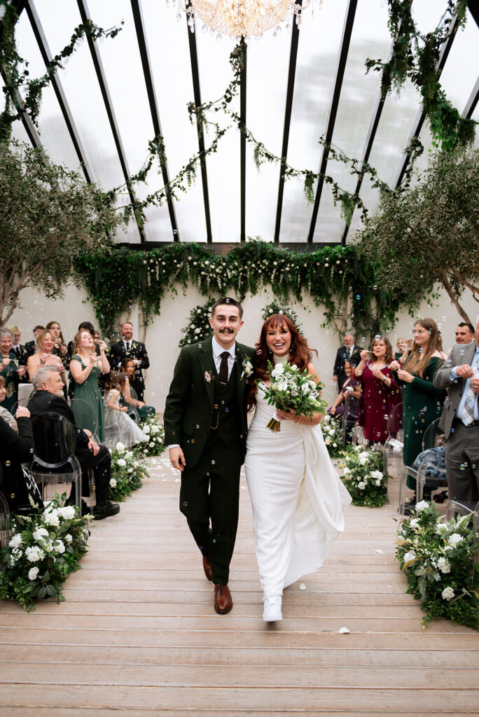 cute picture of the newlyweds heading to their wedding reception