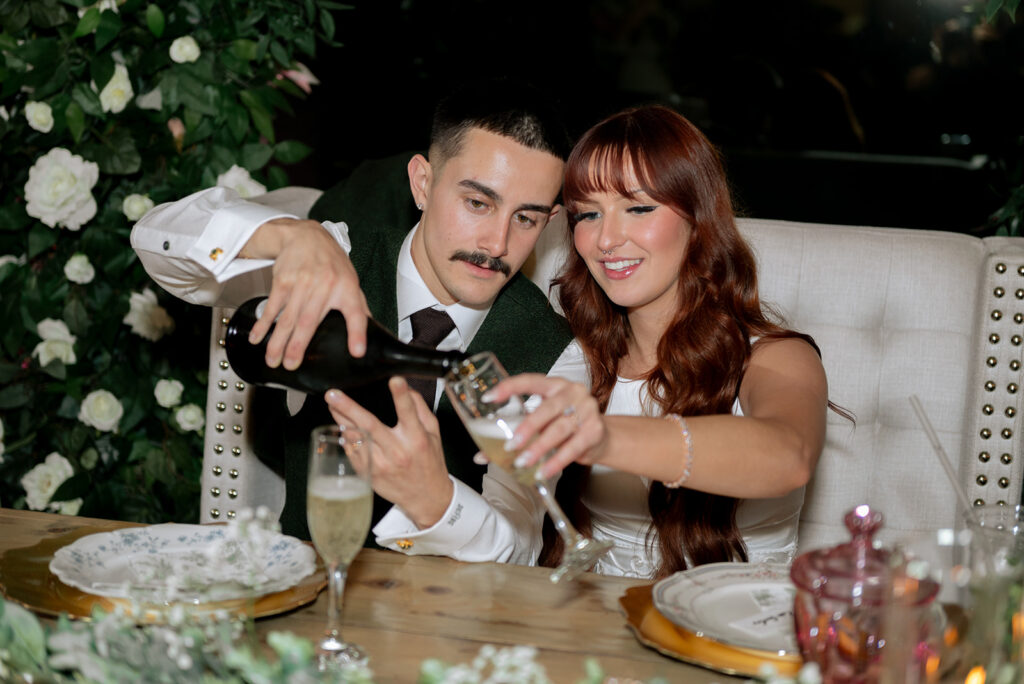 newlyweds celebrating their wedding with champagne  