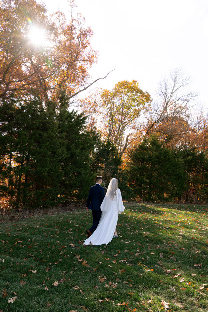 cute picture of the bride and groom holding hands
