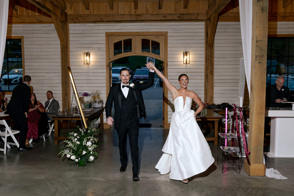 Newly married couple arriving at their wedding reception