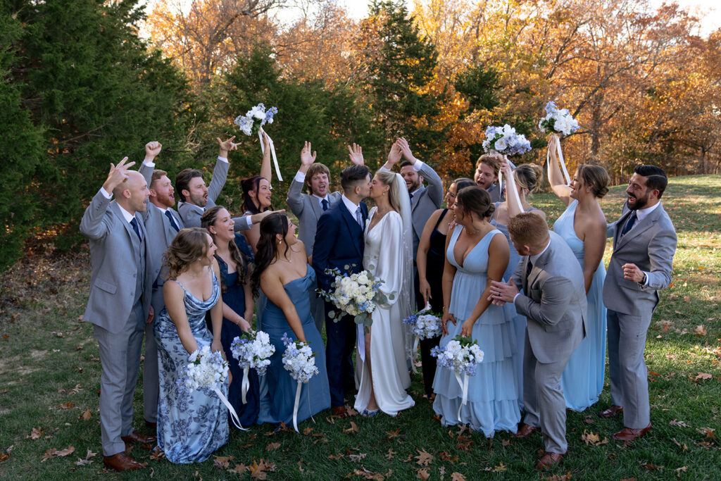 cute picture of the bride and groom with their bridal parties