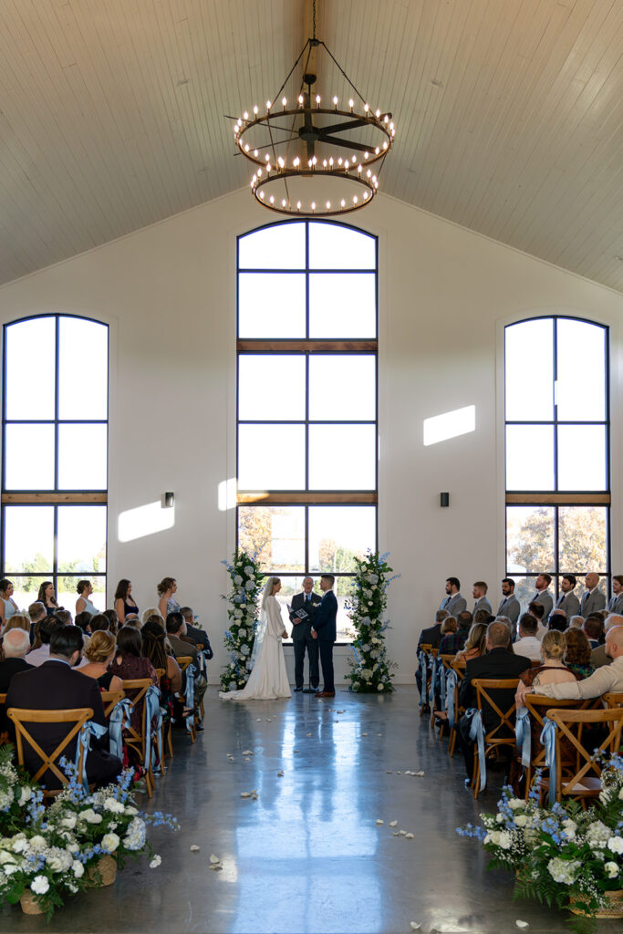 bride and groom holding hands during their ceremony