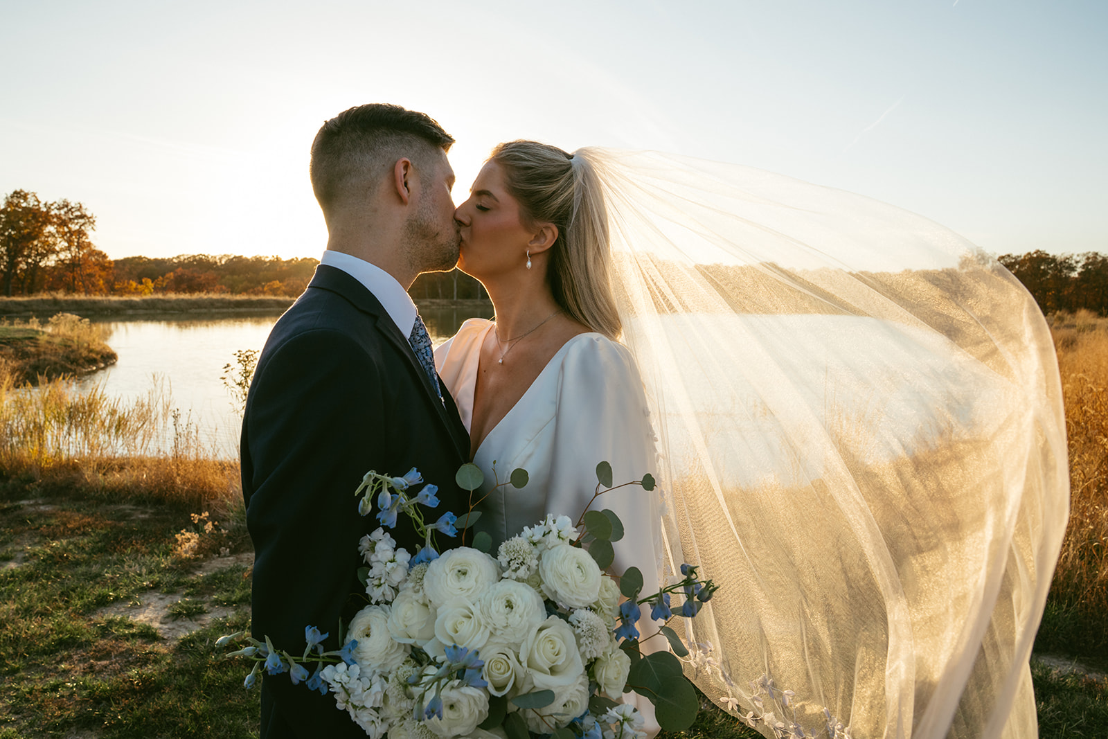 beautiful portrait of the newlyweds kissing