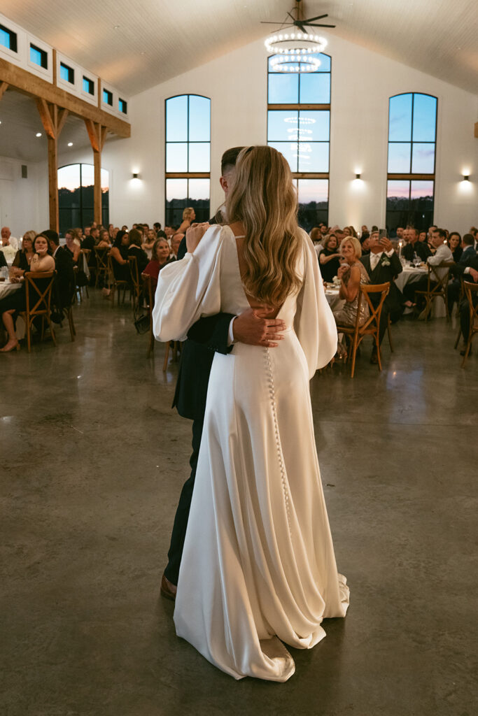 cute picture of the newlyweds dancing during at their wedding reception party