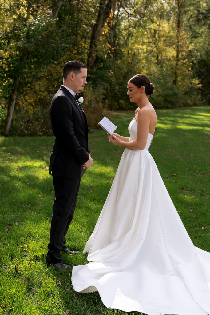 Bride and groom, reading their vows
