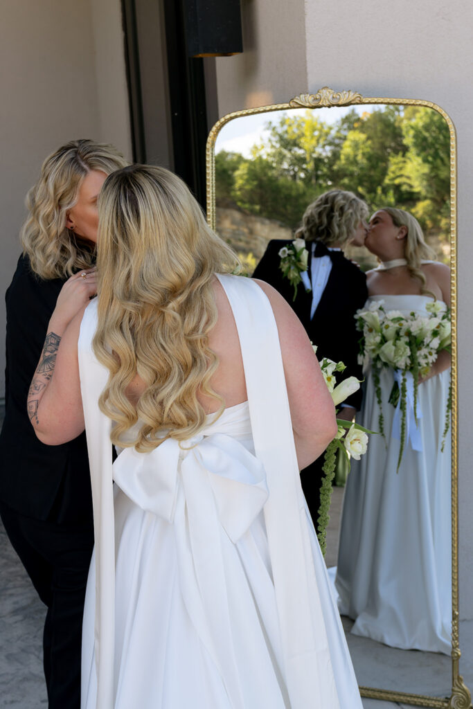 cute picture of the couple kissing during their bridal portraits