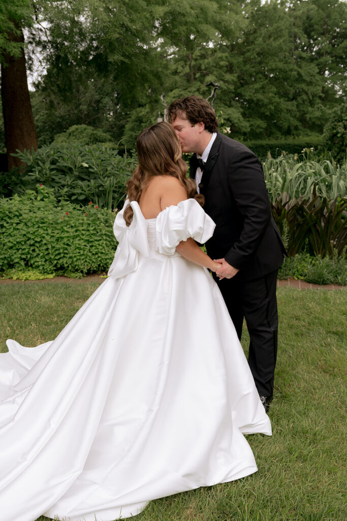 cute picture of the bride and groom kissing