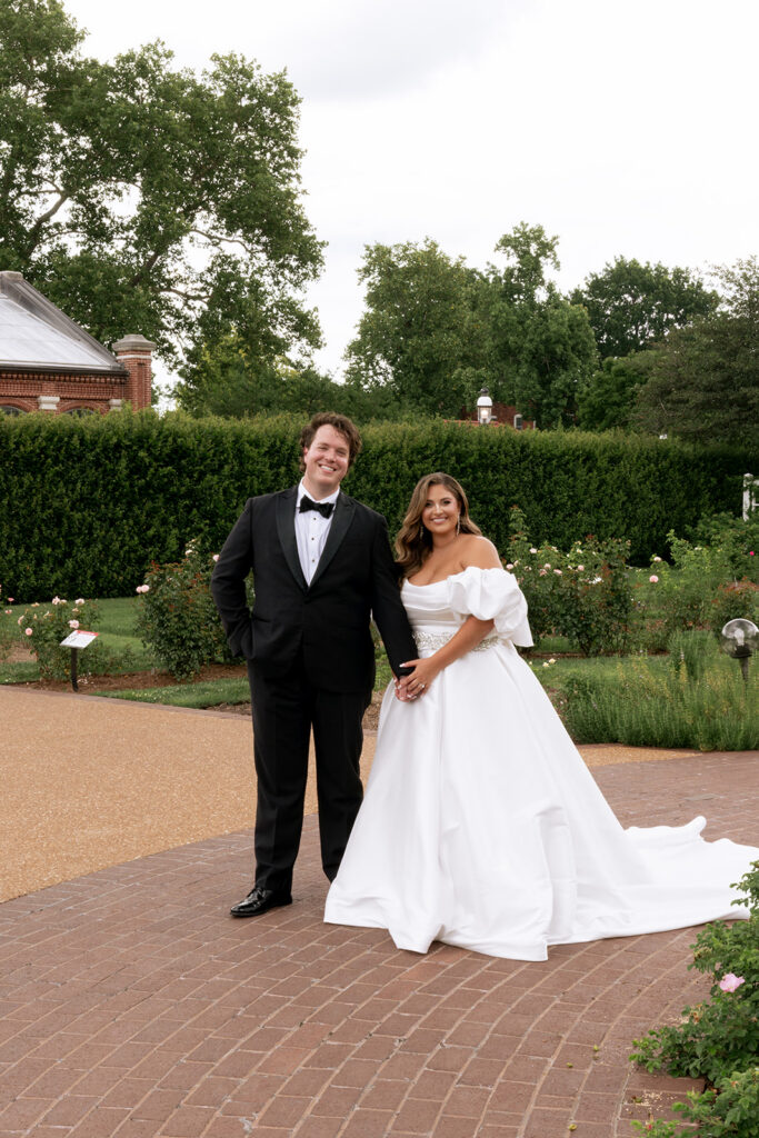 cute picture of the bride and groom holding hands