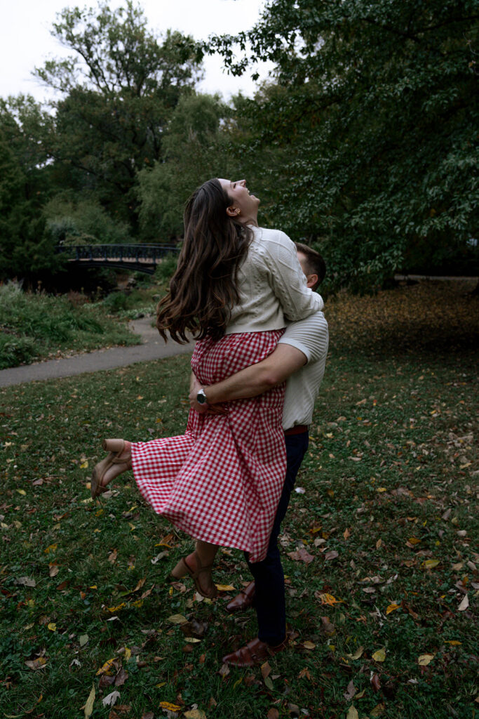 cute picture of the couple laughing with each other during their photoshoot