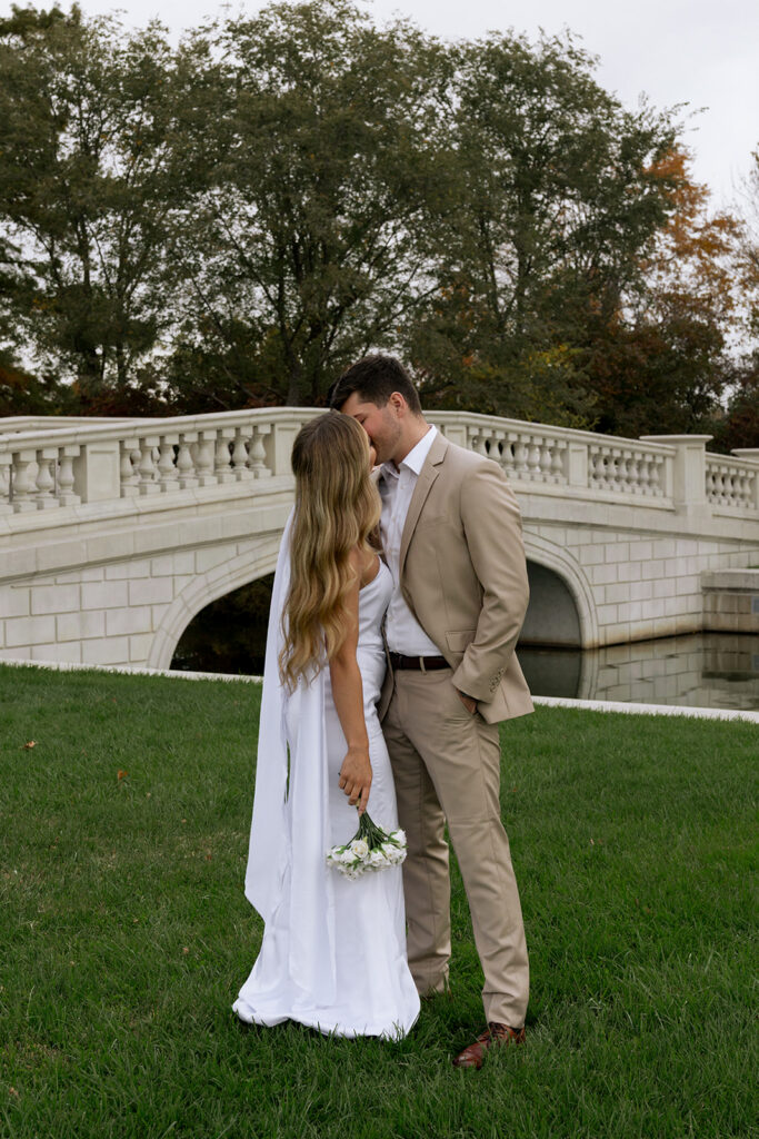 cute picture of the couple kissing during their photoshoot