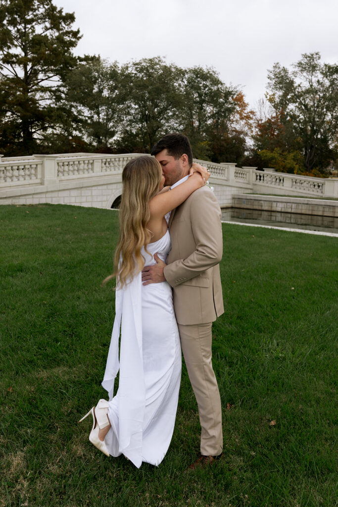 couple hugging during their portraits in st. louis