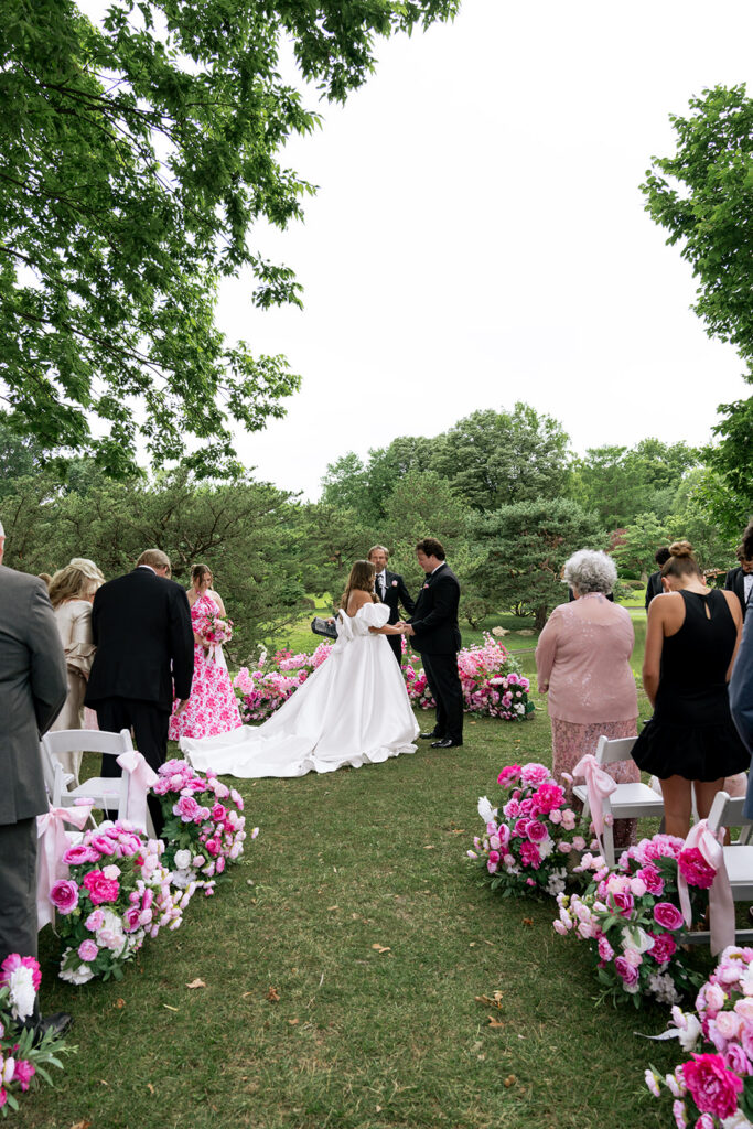 cute picture of the bride and groom holding hands during their wedding ceremony