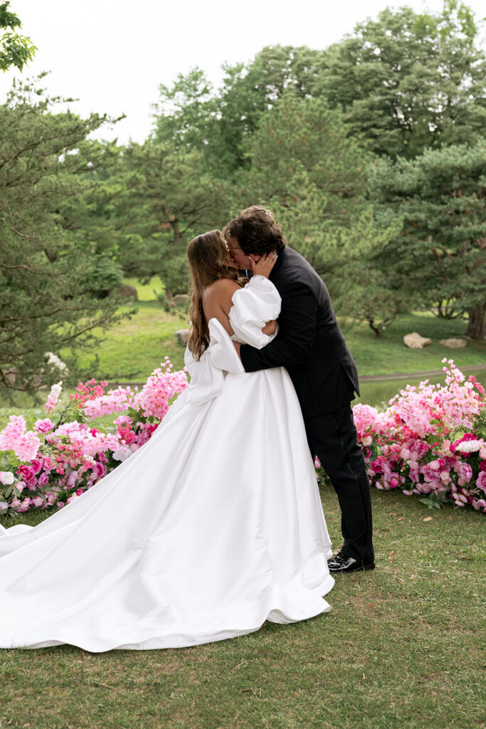 newlyweds kissing after their ceremony