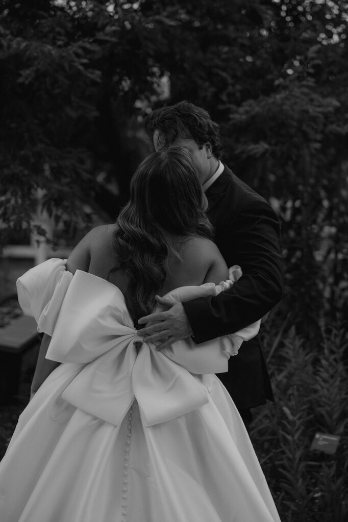 cute picture of the bride and groom hugging