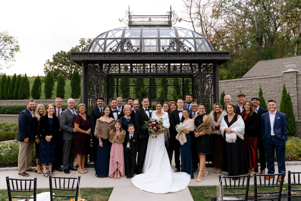 picture of the bride and groom with their family